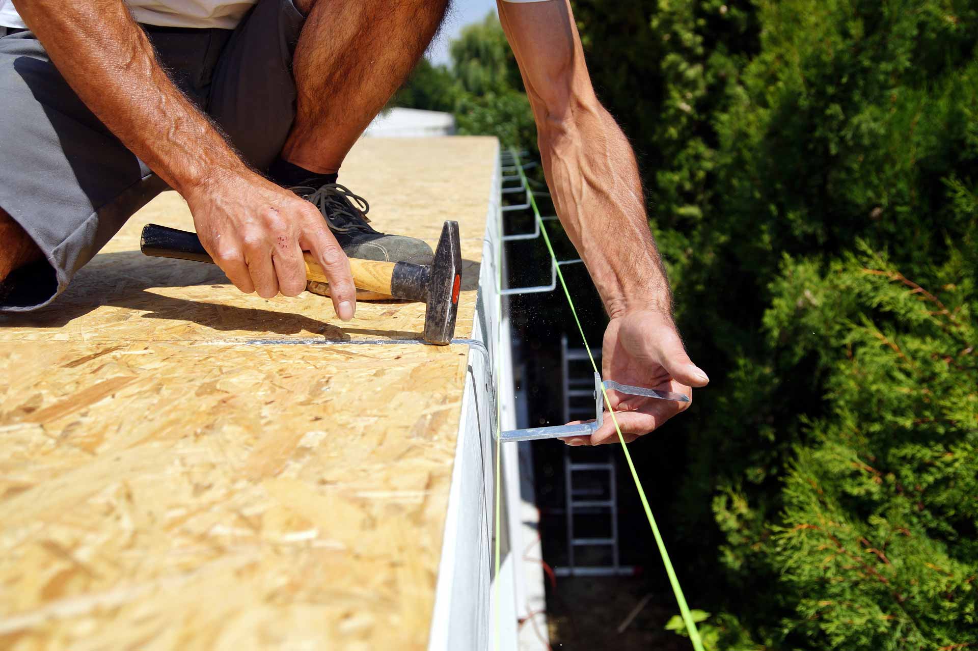 Man installing gutters